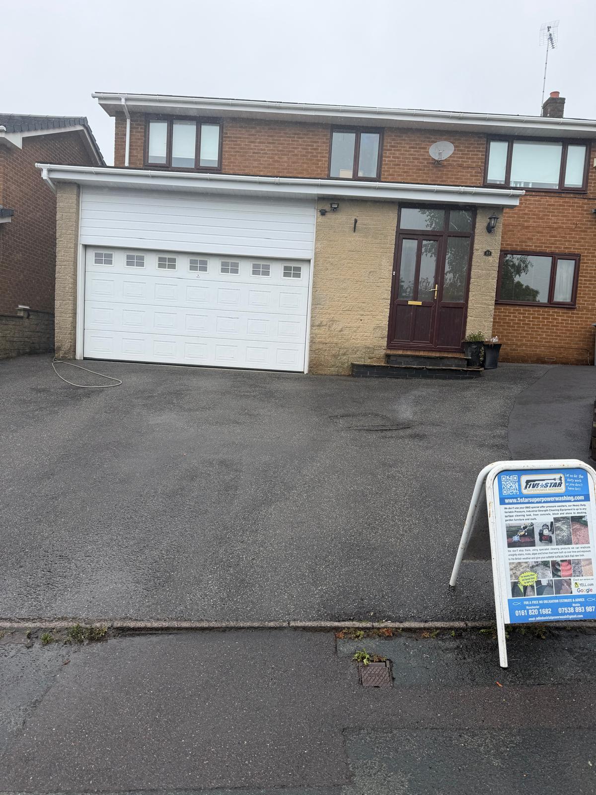 Completed driveway cleaning with 5 Star branded A-board sign outside UK home