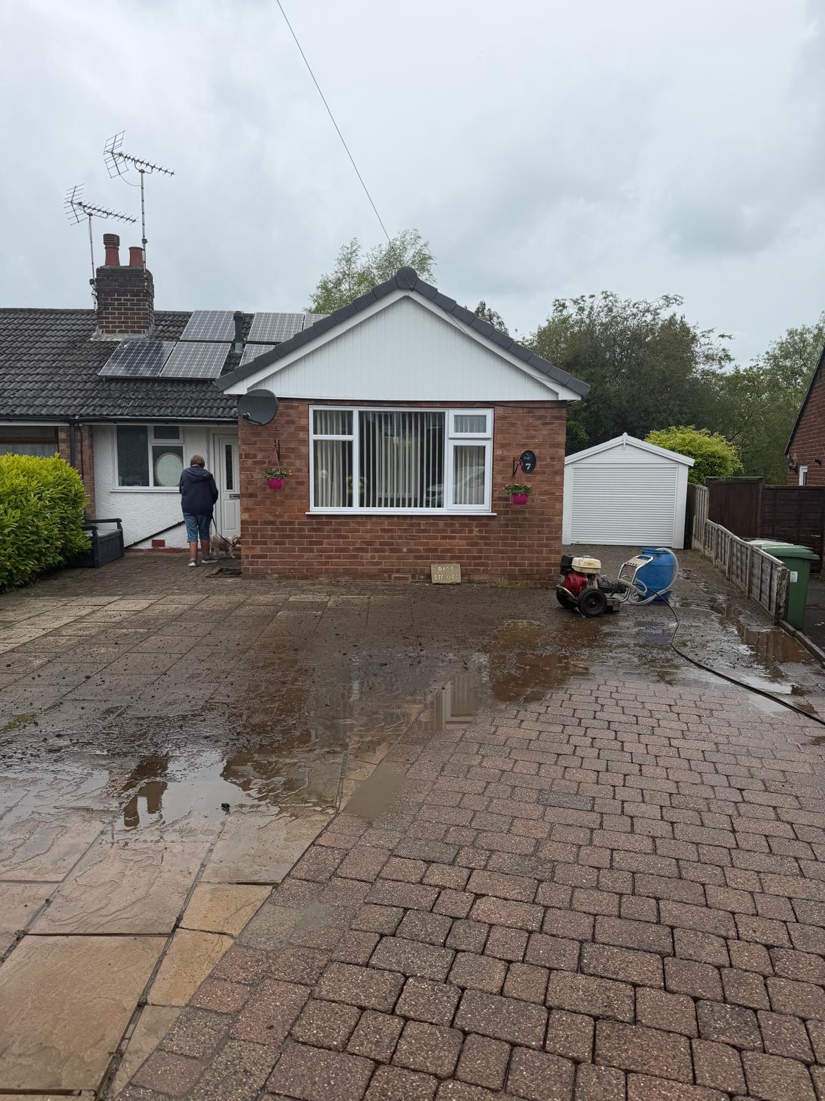 Bungalow driveway before cleaning - dirty flagstones and muddy block paving