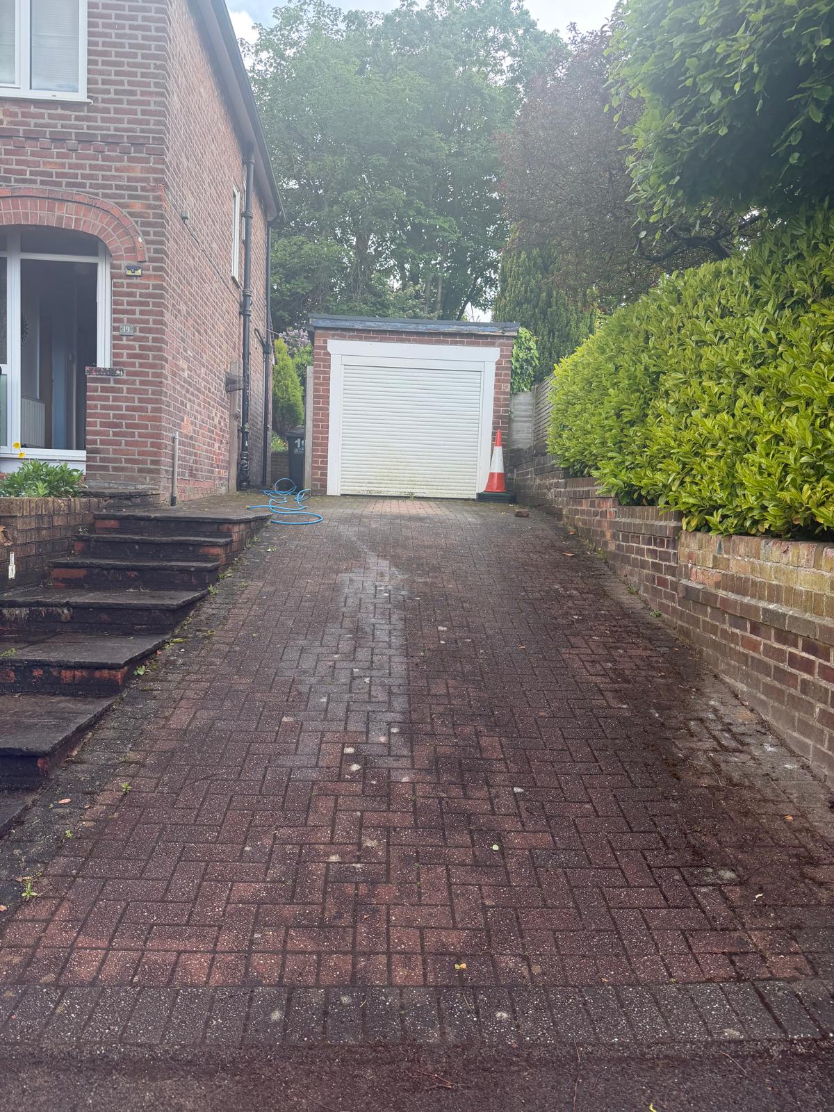 Herringbone block paving driveway before cleaning - faded and weathered surface
