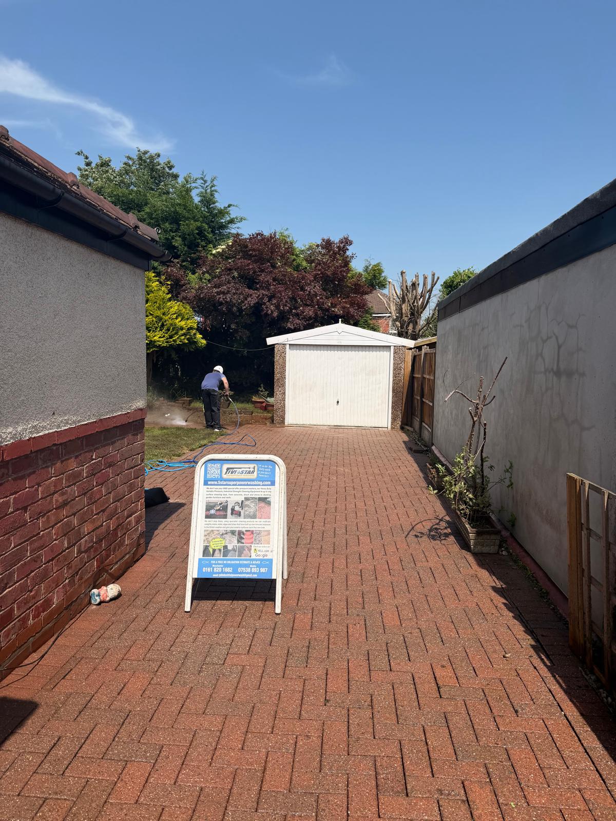 Block paving side passage after cleaning - joints cleared and surface restored
