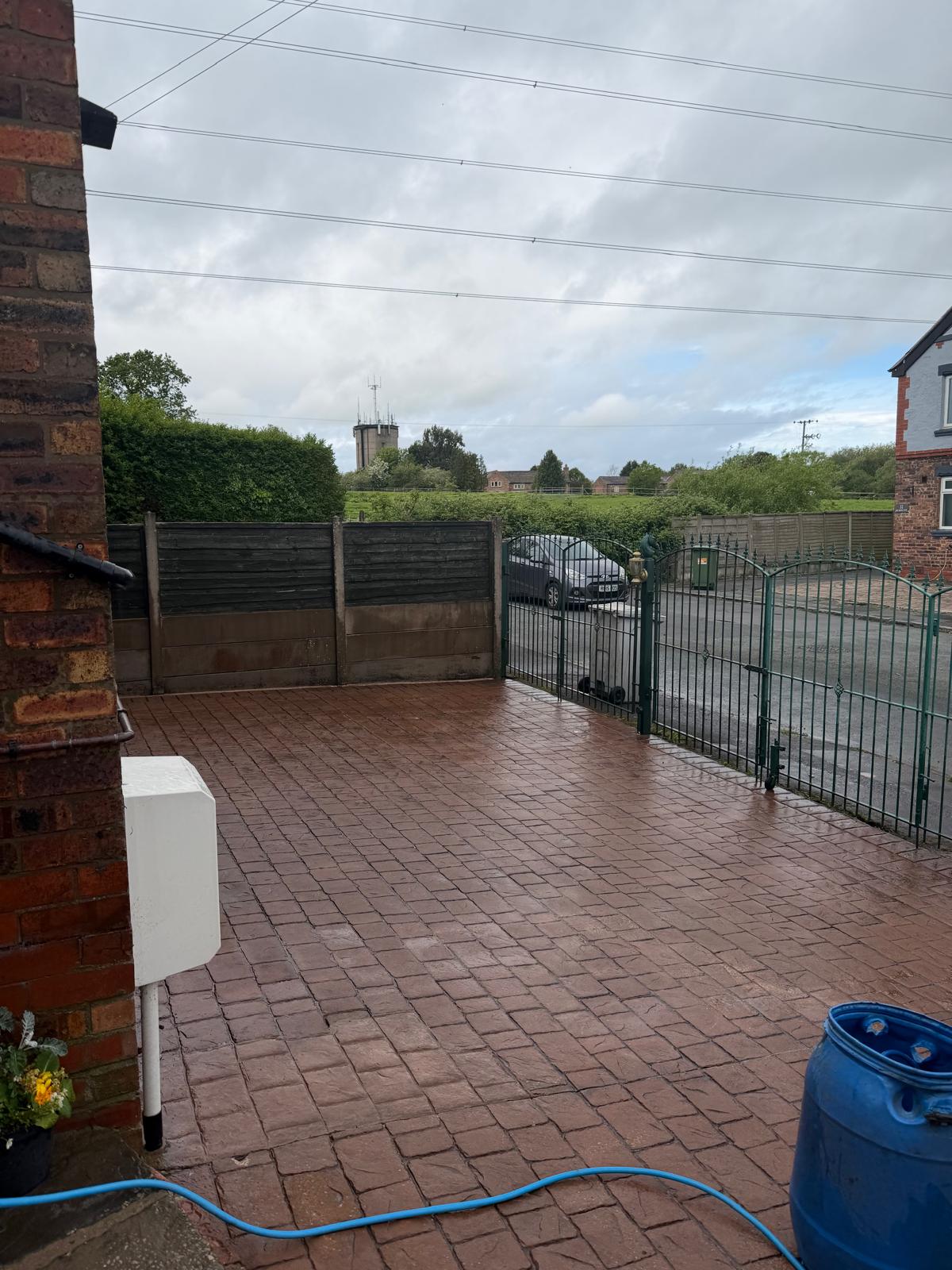 Stamped concrete driveway after cleaning - pattern and colour fully restored