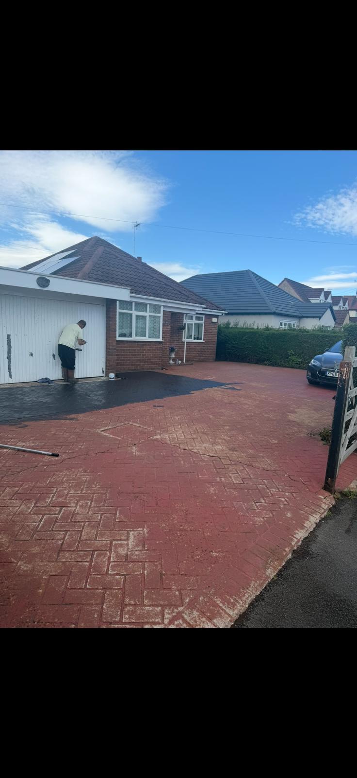 Block paving driveway before sealing - faded red paving with worn surface